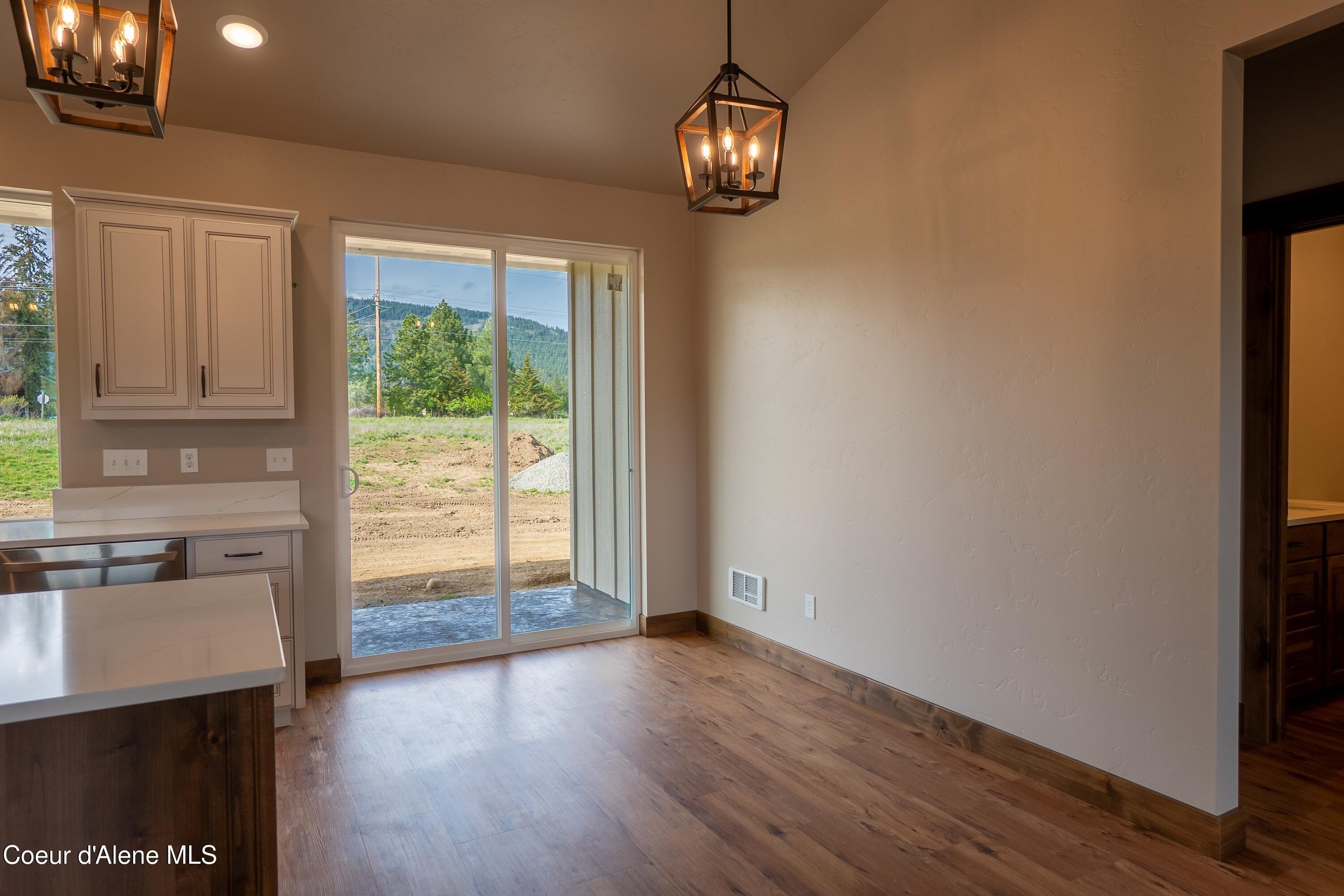 167 Airstrip Road Moyie Springs, ID 83845 - Photo 14 of 27 Dining w slider to back yard