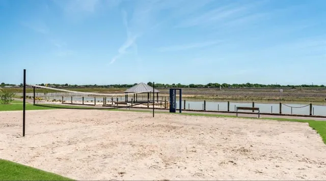 swimming pool view with a seating space