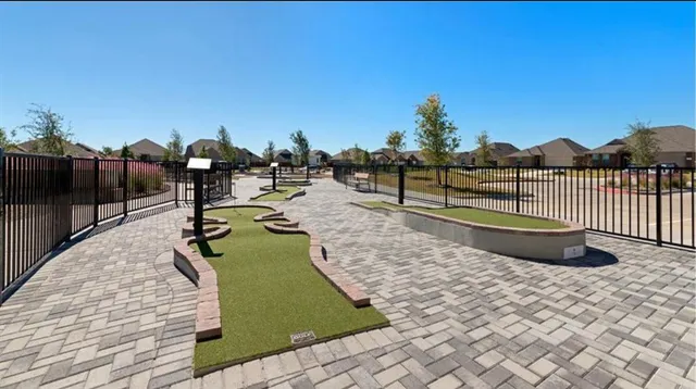 a view of a swimming pool with a lawn chairs