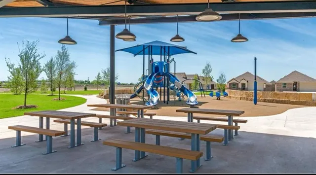 a swimming pool with outdoor seating and yard