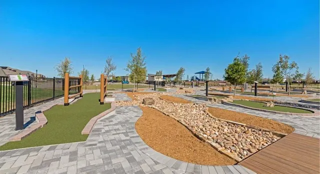 a view of a swimming pool with a lounge chairs