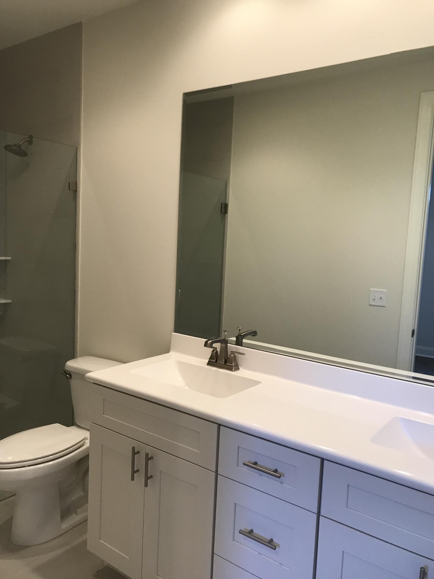 213 Chapman Street Santa Rosa Beach, FL 32459 - Photo 13 of 30 a bathroom with a sink a toilet and vanity