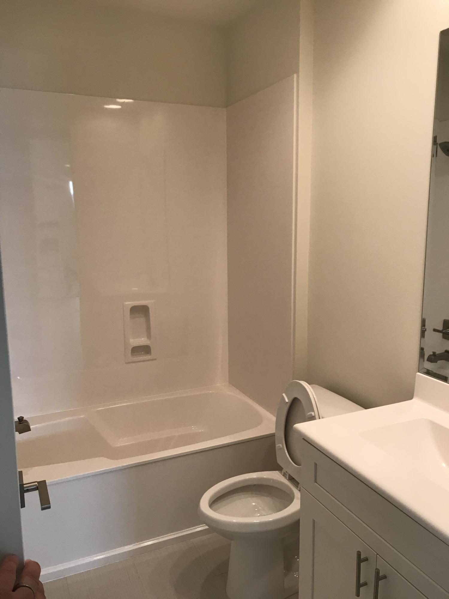 213 Chapman Street Santa Rosa Beach, FL 32459 - Photo 16 of 30 a bathroom with a sink a toilet and a bathtub