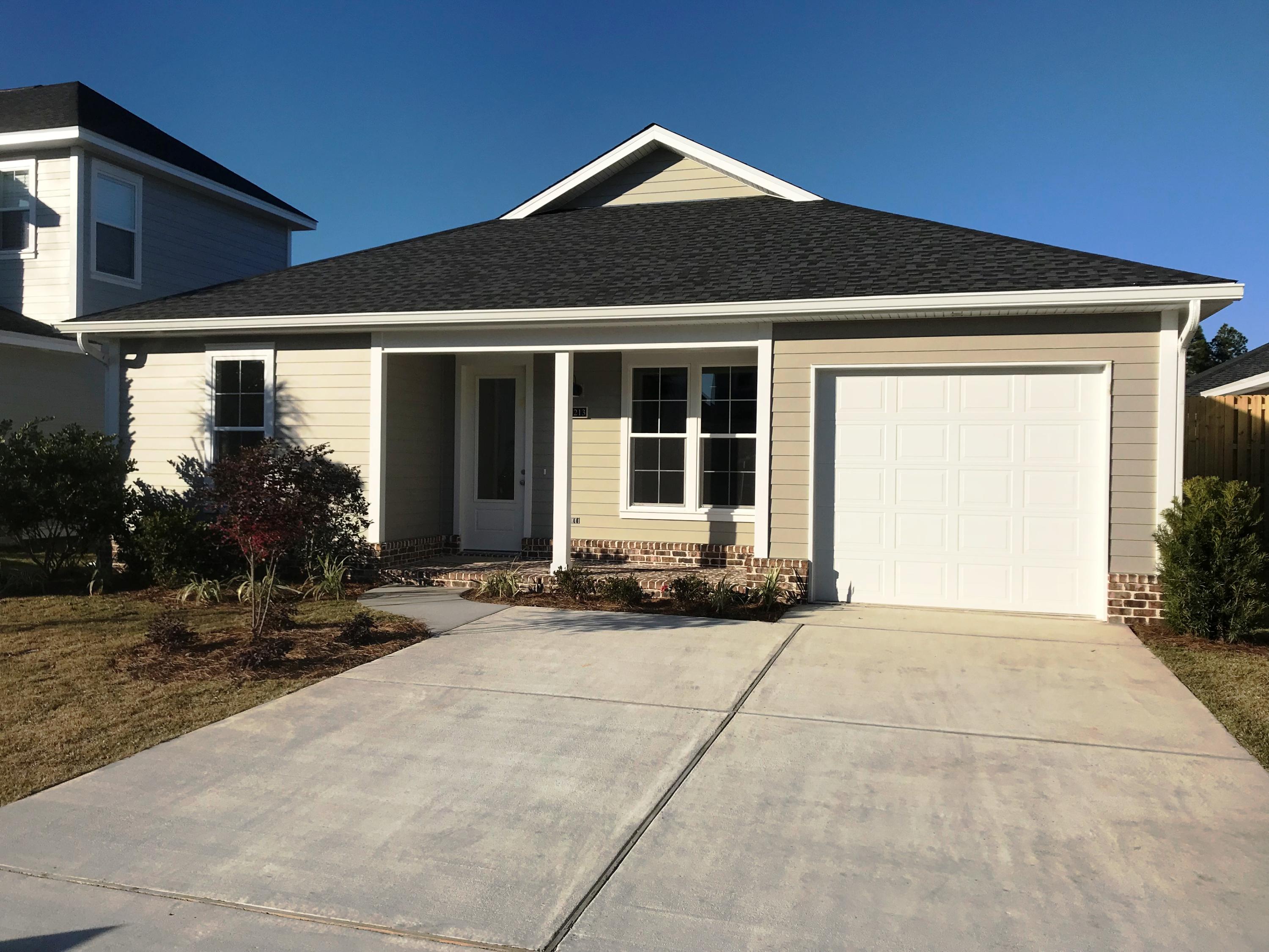 213 Chapman Street Santa Rosa Beach, FL 32459 - Photo 22 of 30 a front view of a house with a yard