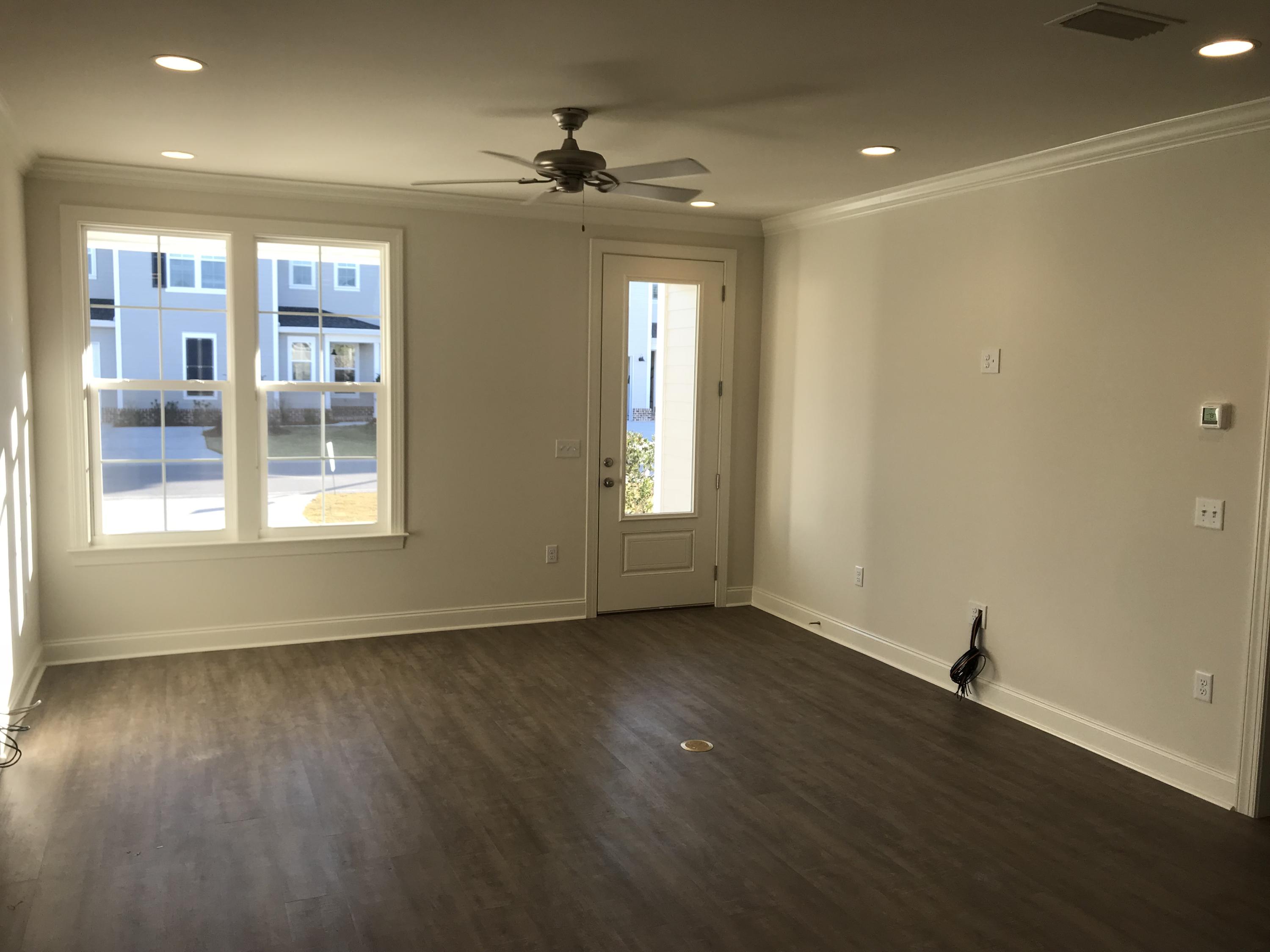 213 Chapman Street Santa Rosa Beach, FL 32459 - Photo 4 of 30 a view of an empty room with glass door and wooden floor