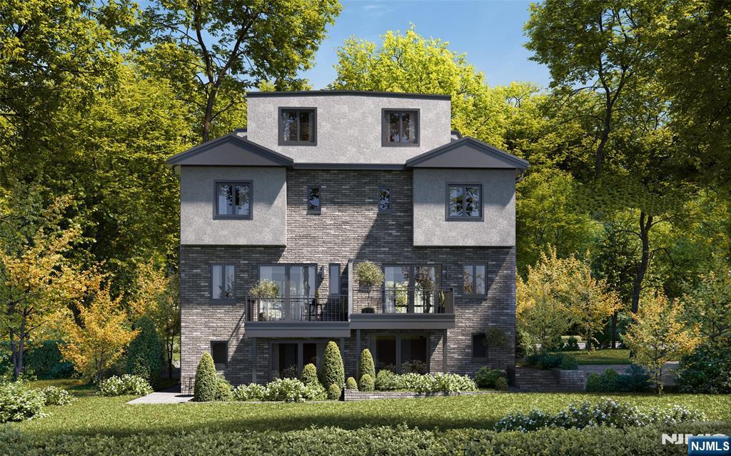 25 Garden Place, Unit B Edgewater, NJ 07020 - Photo 4 of 4 a front view of house with a garden