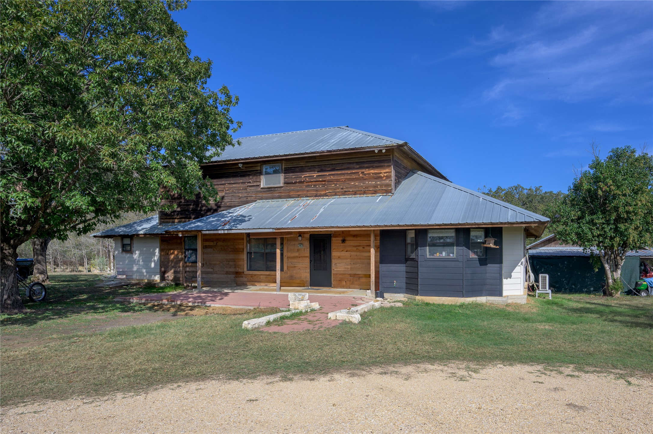 368 Lytton Lane Dale, TX 78616 - Photo 3 of 29 View of front facade featuring a metal roof, covered porch, and a front lawn