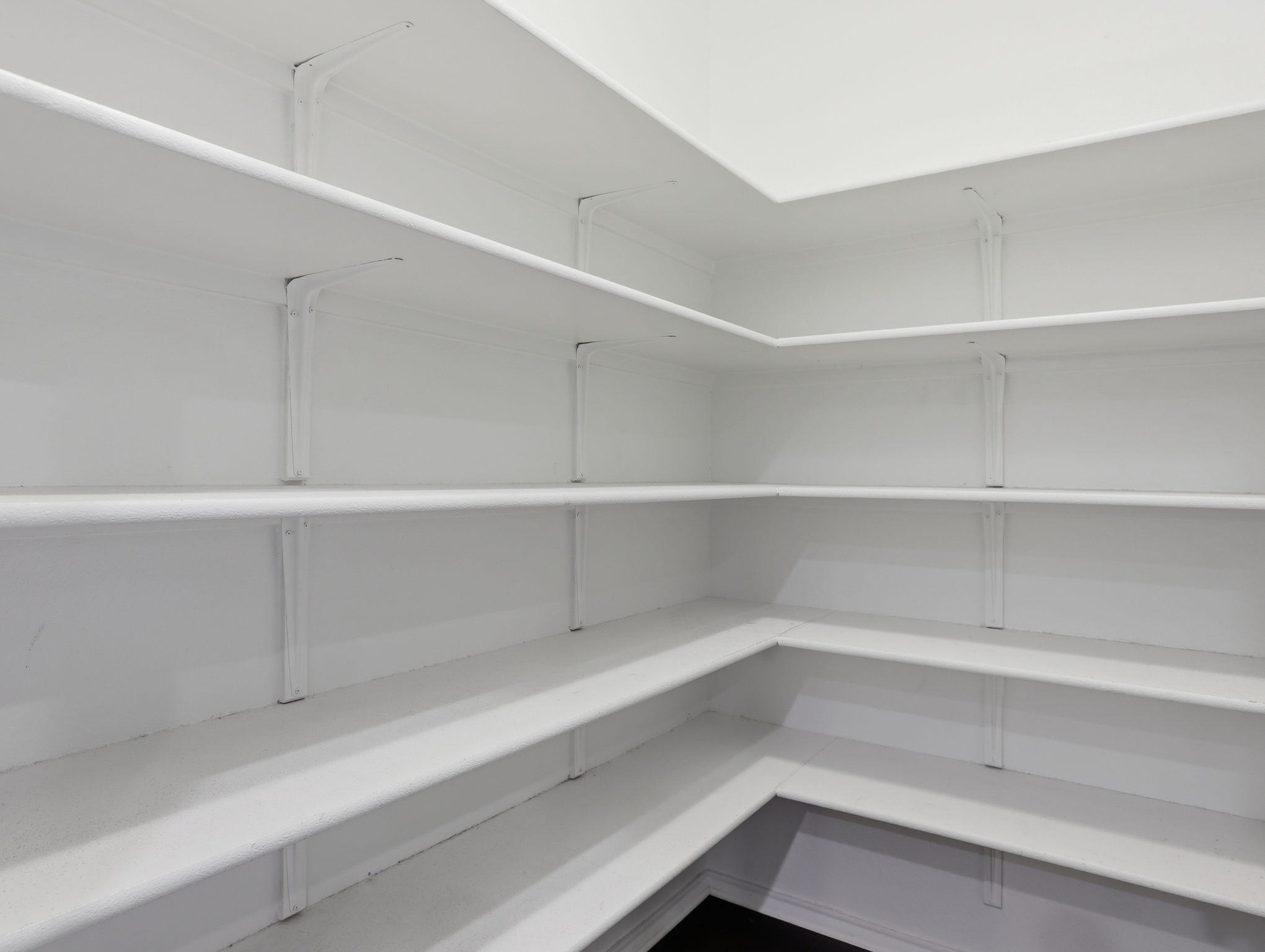 640 Landon Samuel Loop Pflugerville, TX 78660 - Photo 22 of 33 Spacious corner pantry featuring multiple levels of white shelving, offering extensive storage capacity