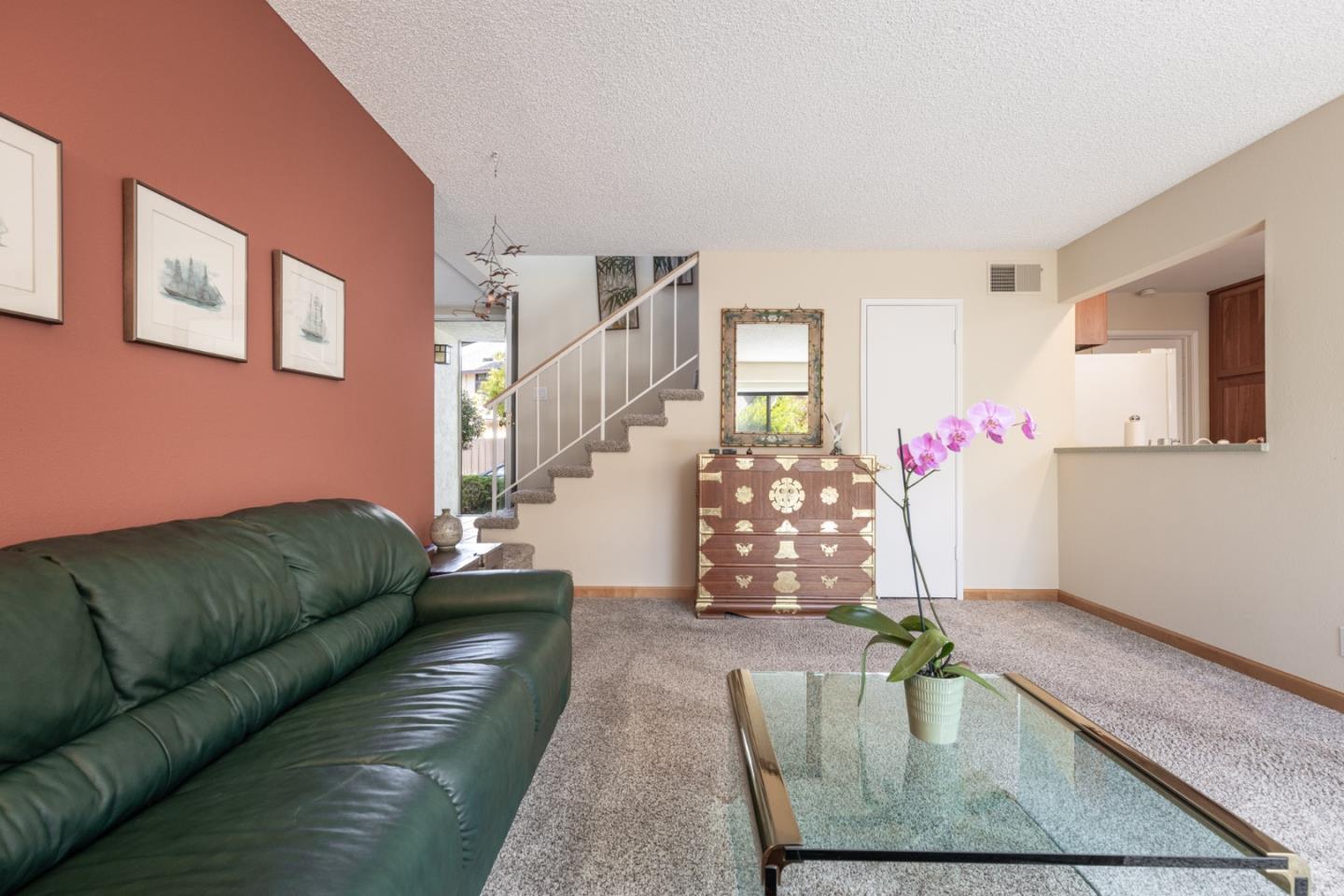 1360 Josselyn Canyon Road, Unit 40 Monterey, CA 93940 - Photo 7 of 18 a living room with furniture and a couch