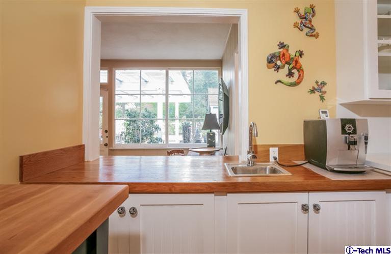 2221 Brigden Road Pasadena, CA 91104 - Photo 11 of 16 a view of kitchen with kitchen island a sink a stove and a window