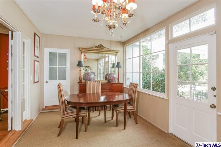 2221 Brigden Road Pasadena, CA 91104 - Photo 7 of 16 a dining room with furniture a chandelier and wooden floor