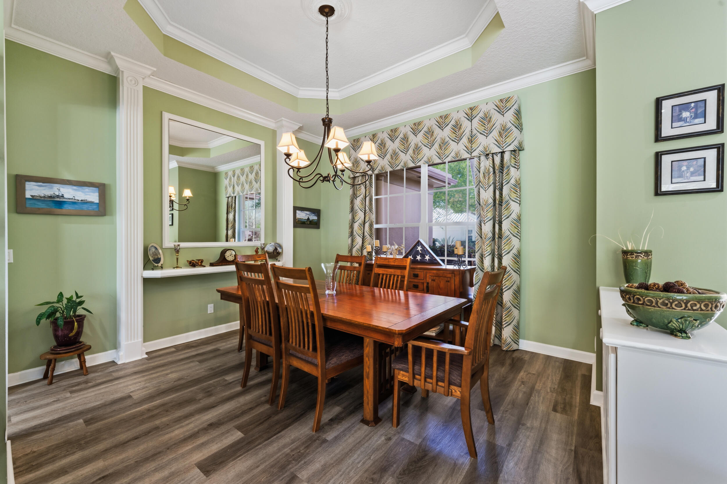 768 Southwest Whisper Ridge Trail Palm City, FL 34990 - Photo 13 of 40 a view of a dining room with furniture window and wooden floor
