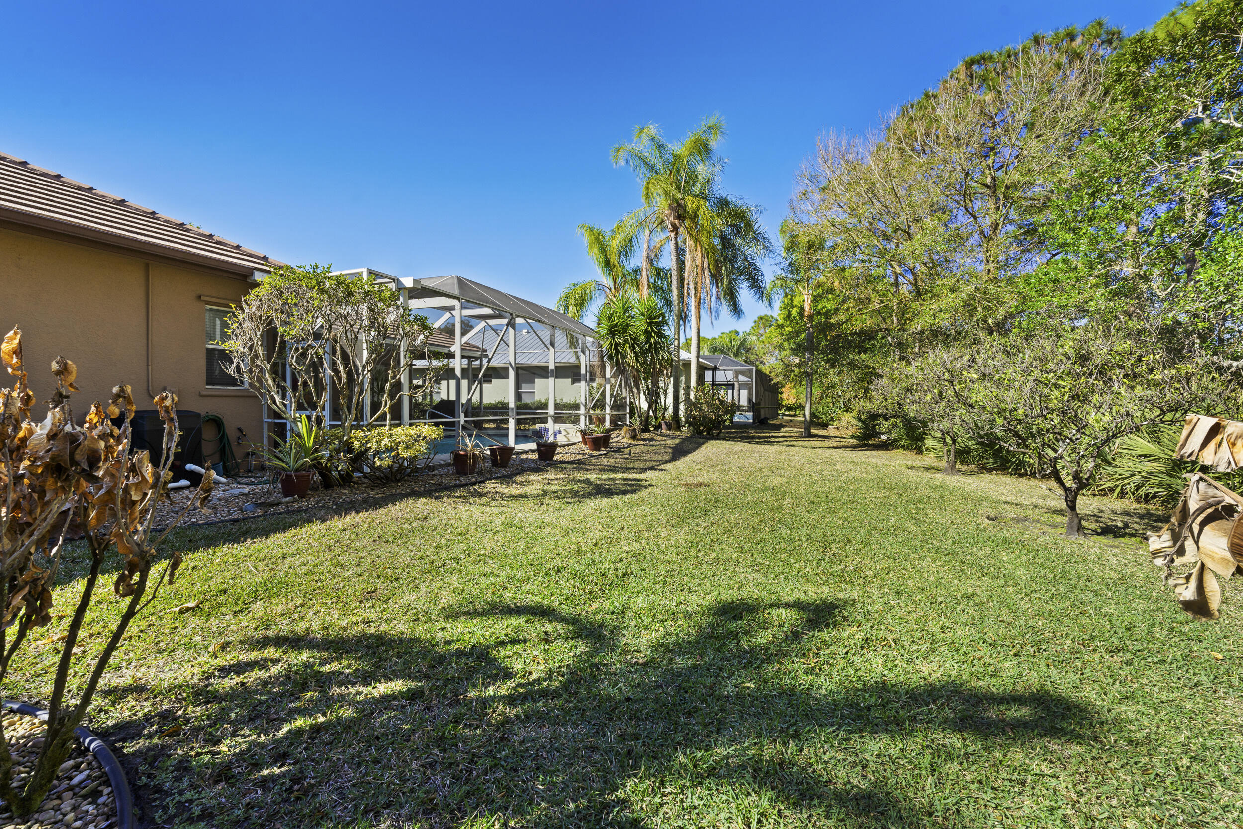 768 Southwest Whisper Ridge Trail Palm City, FL 34990 - Photo 30 of 40 a view of outdoor space with garden