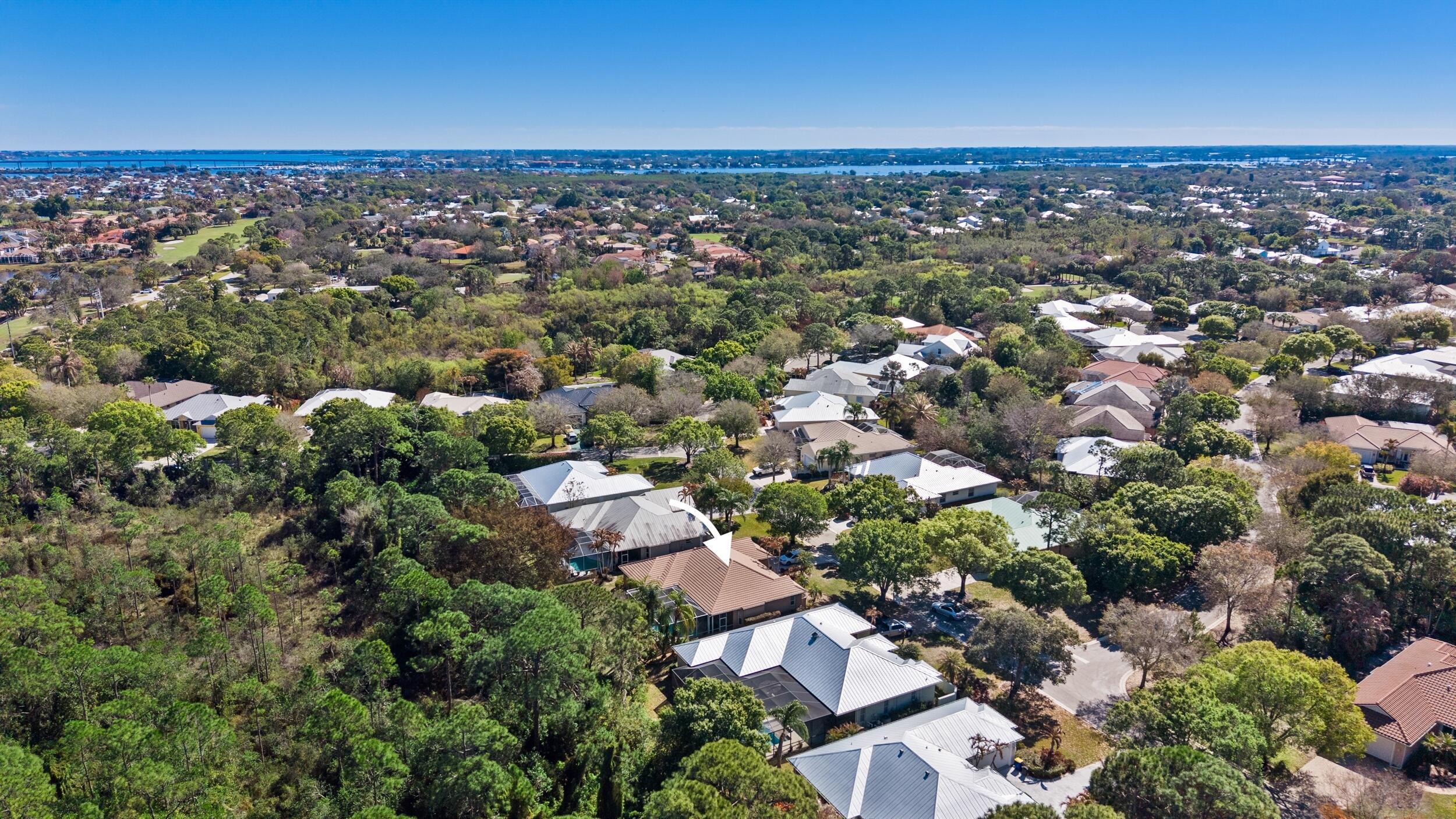 768 Southwest Whisper Ridge Trail Palm City, FL 34990 - Photo 33 of 40 an aerial view of a city with lots of residential buildings