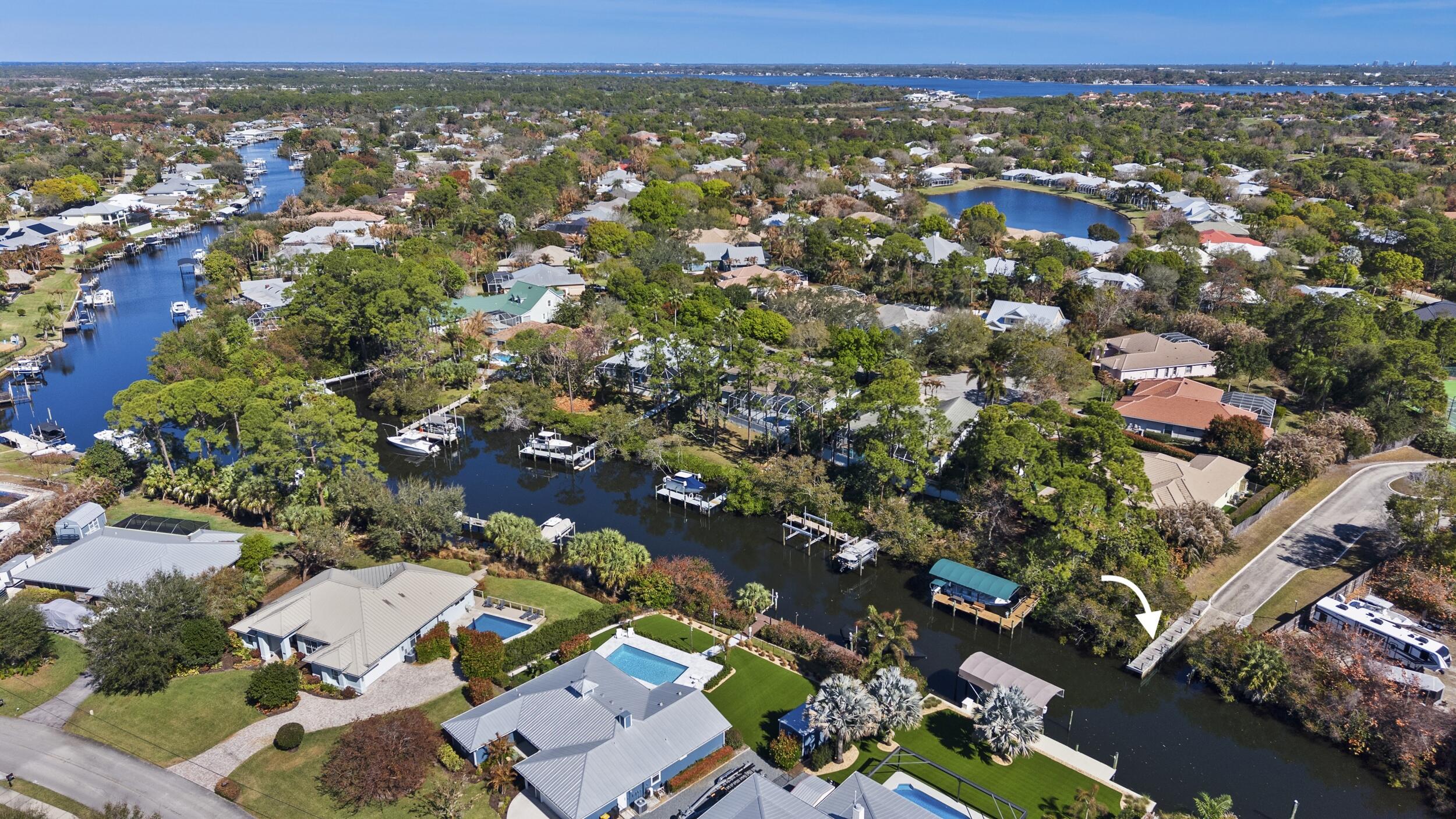 768 Southwest Whisper Ridge Trail Palm City, FL 34990 - Photo 34 of 40 an aerial view of a city with lots of residential buildings
