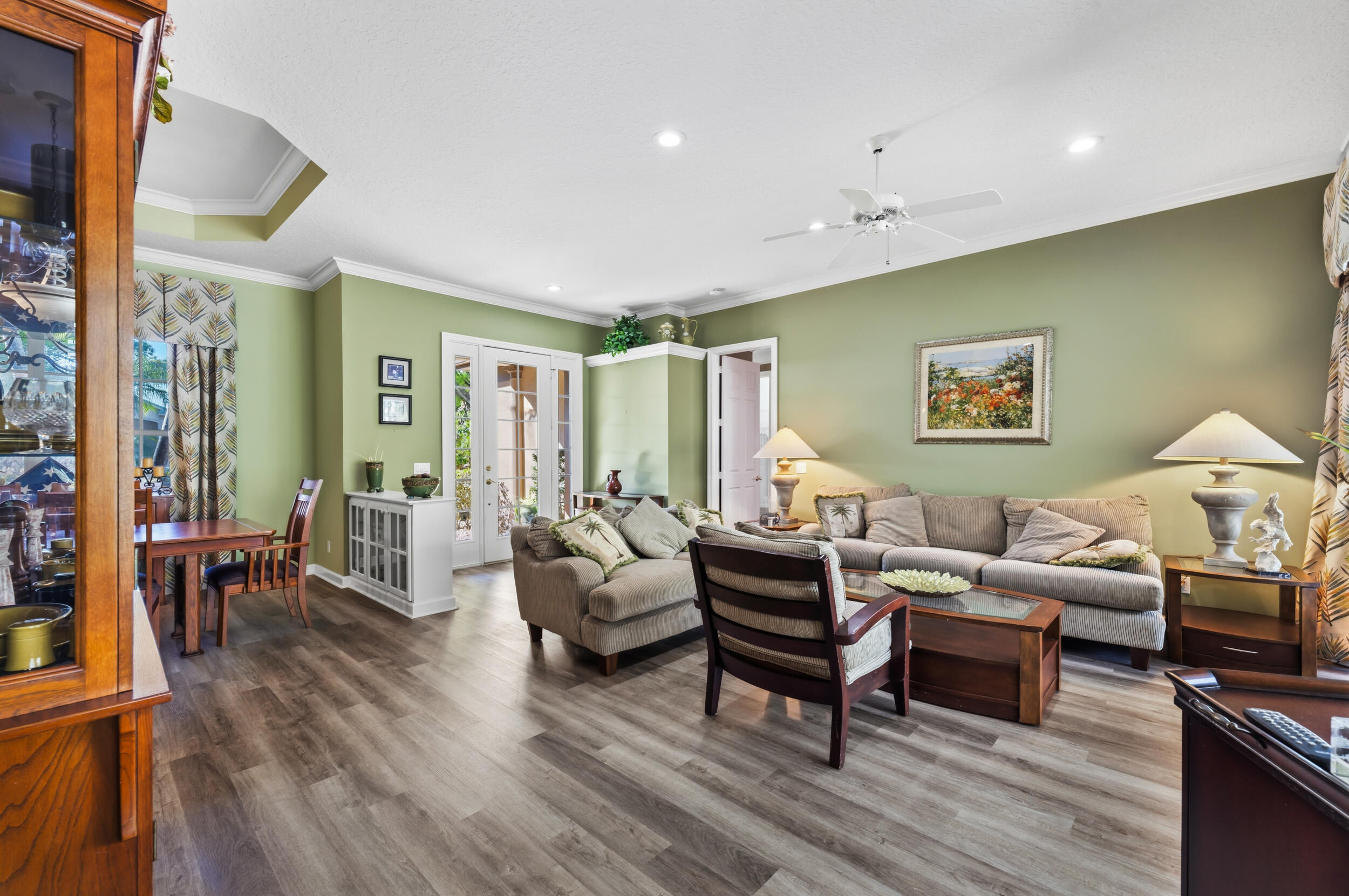 768 Southwest Whisper Ridge Trail Palm City, FL 34990 - Photo 9 of 40 a living room with furniture and wooden floor