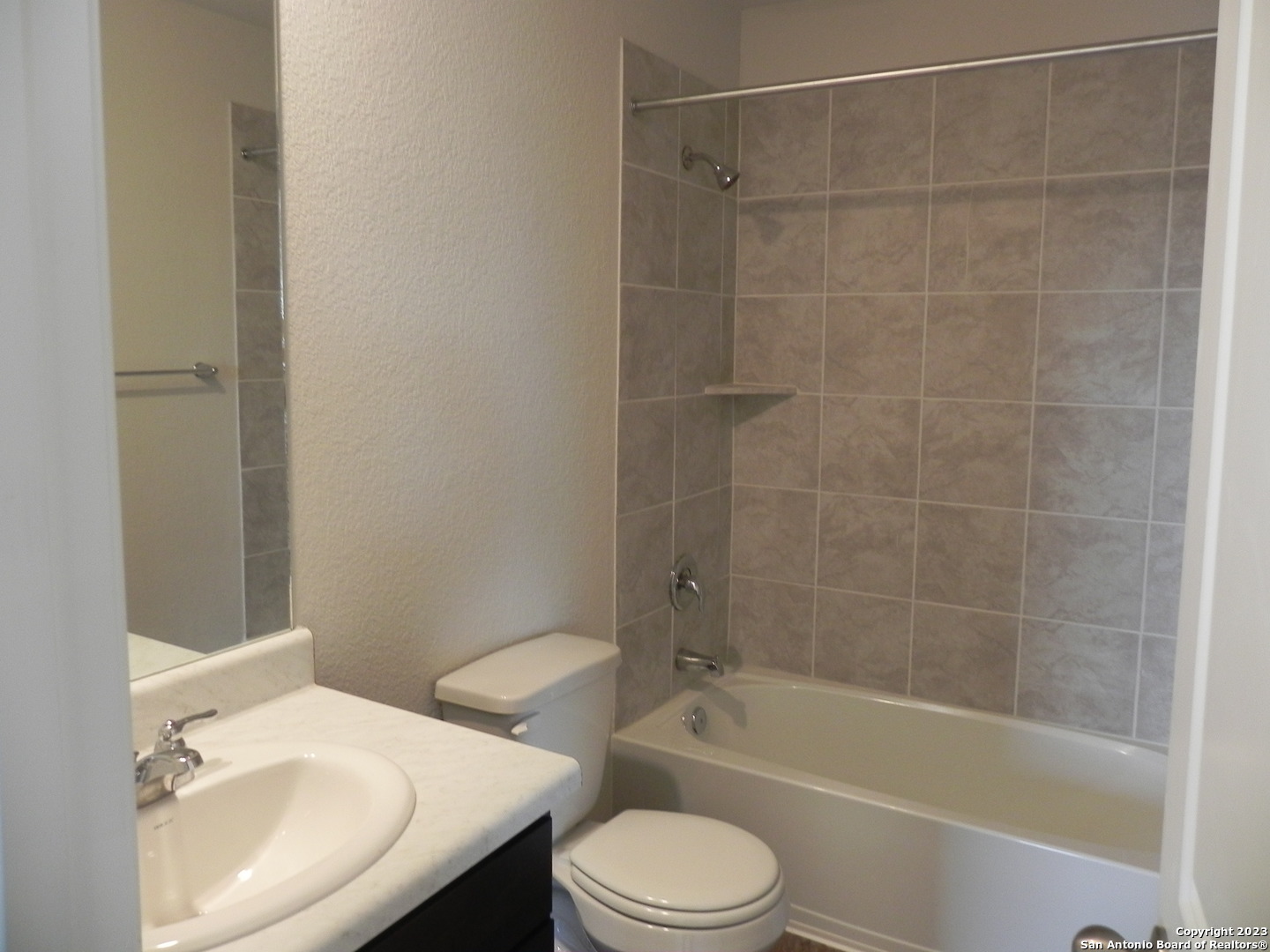 9506 Ranch Loop San Antonio, TX 78254 - Photo 17 of 25 a bathroom with a sink toilet and shower