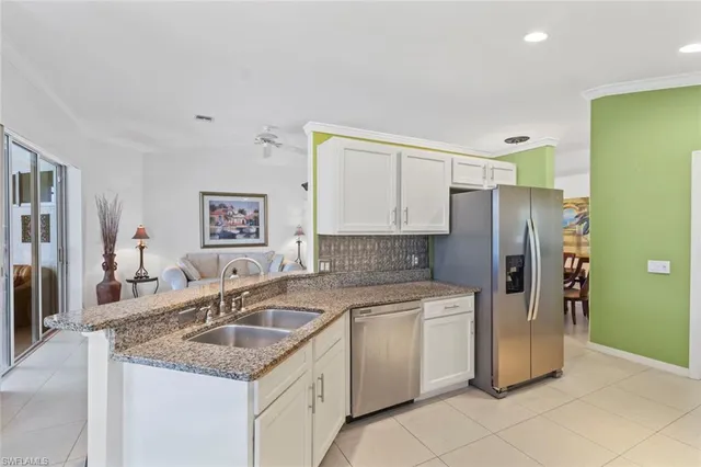 a kitchen with a sink stove and refrigerator
