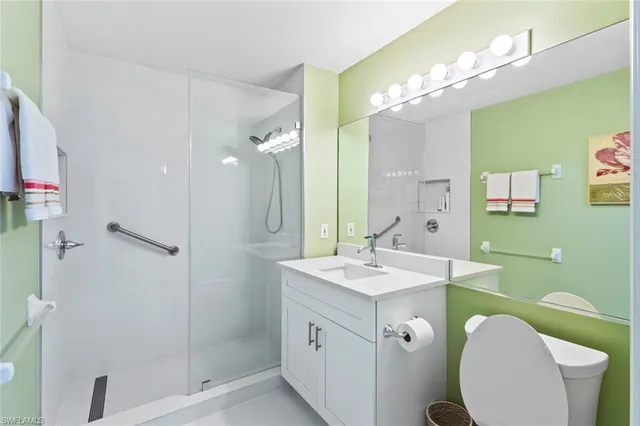 a spacious bathroom with a double vanity sink mirror and toilet