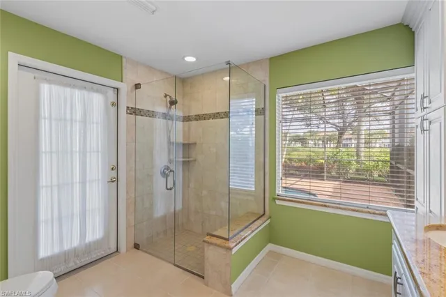 a bathroom with a shower and a tub