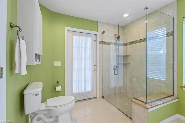 a bathroom with a shower and a toilet