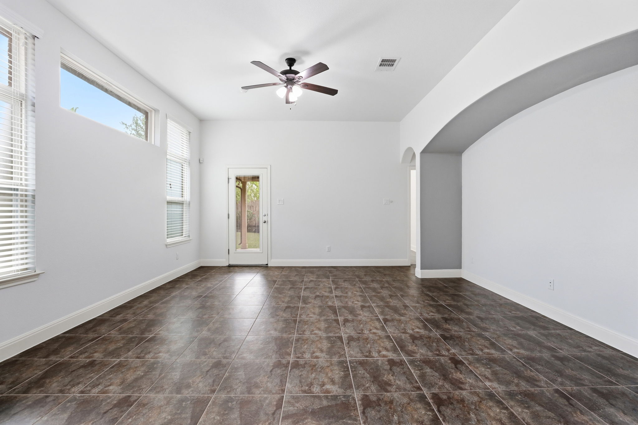 152 Stone View Trail Austin, TX 78737 - Photo 12 of 29 a view of an empty room with chandelier fan and fire place
