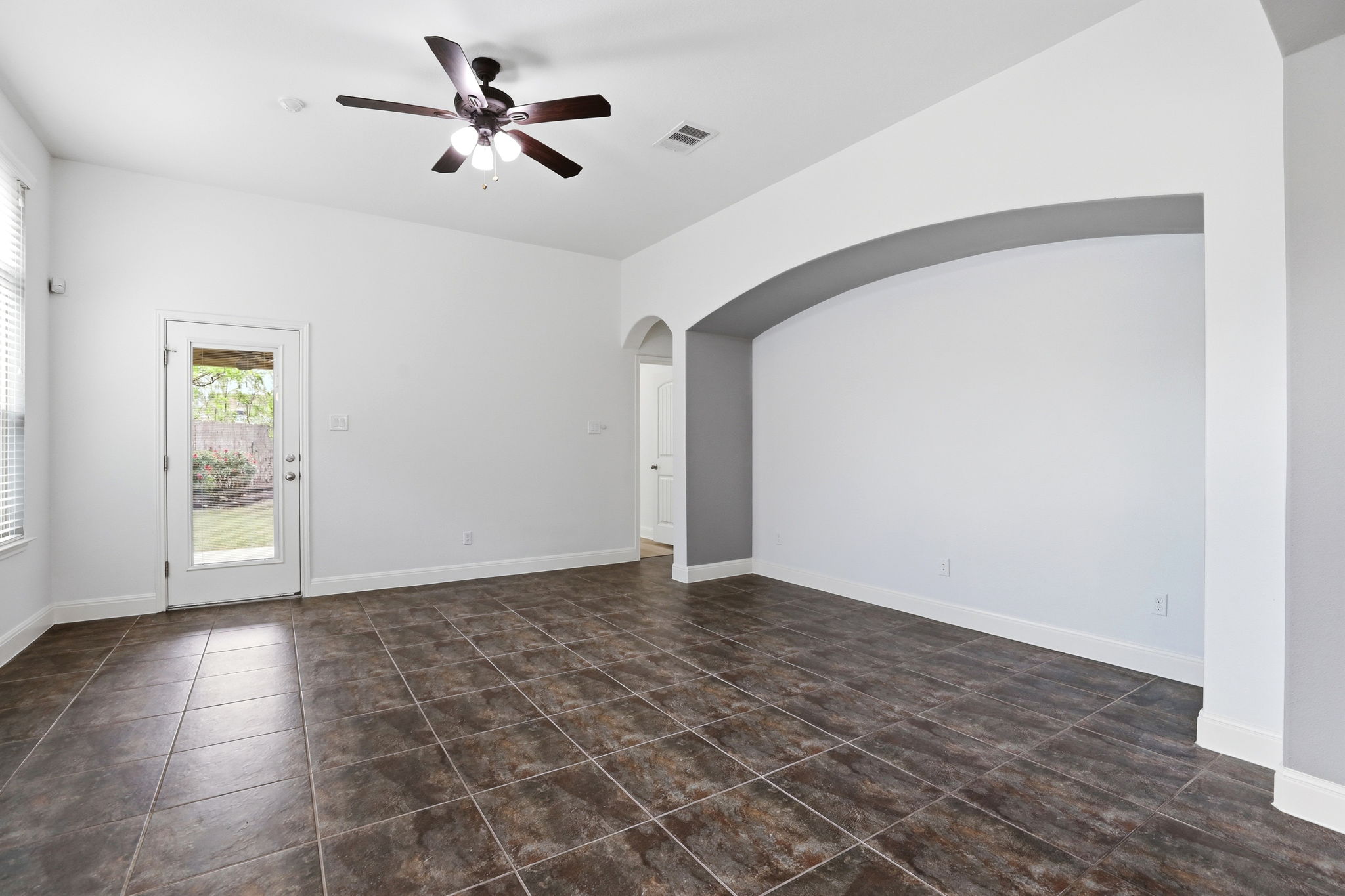 152 Stone View Trail Austin, TX 78737 - Photo 13 of 29 a view of an empty room with window and a ceiling fan