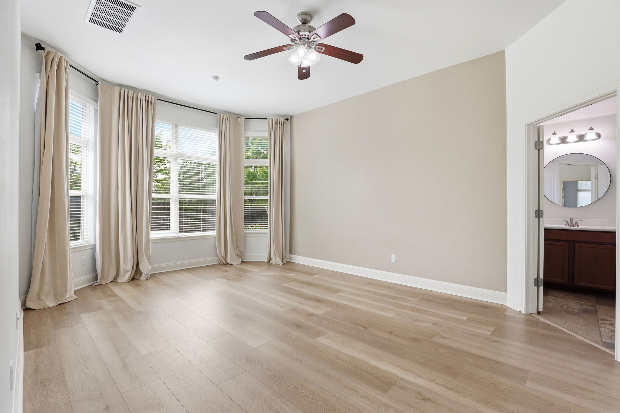 152 Stone View Trail Austin, TX 78737 - Photo 15 of 29 a view of empty room with wooden floor and fan