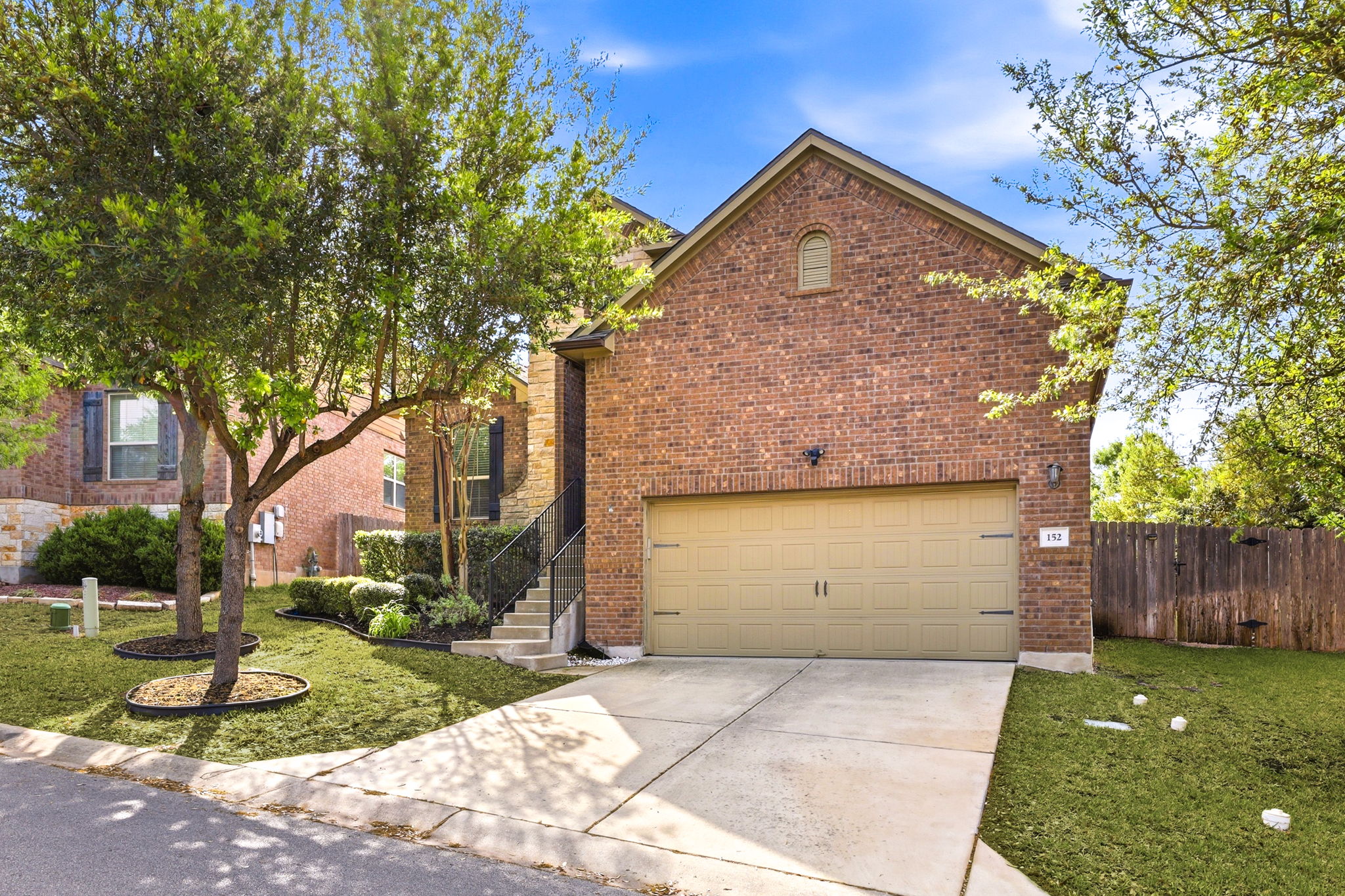 152 Stone View Trail Austin, TX 78737 - Photo 3 of 29 a front view of a house with garden