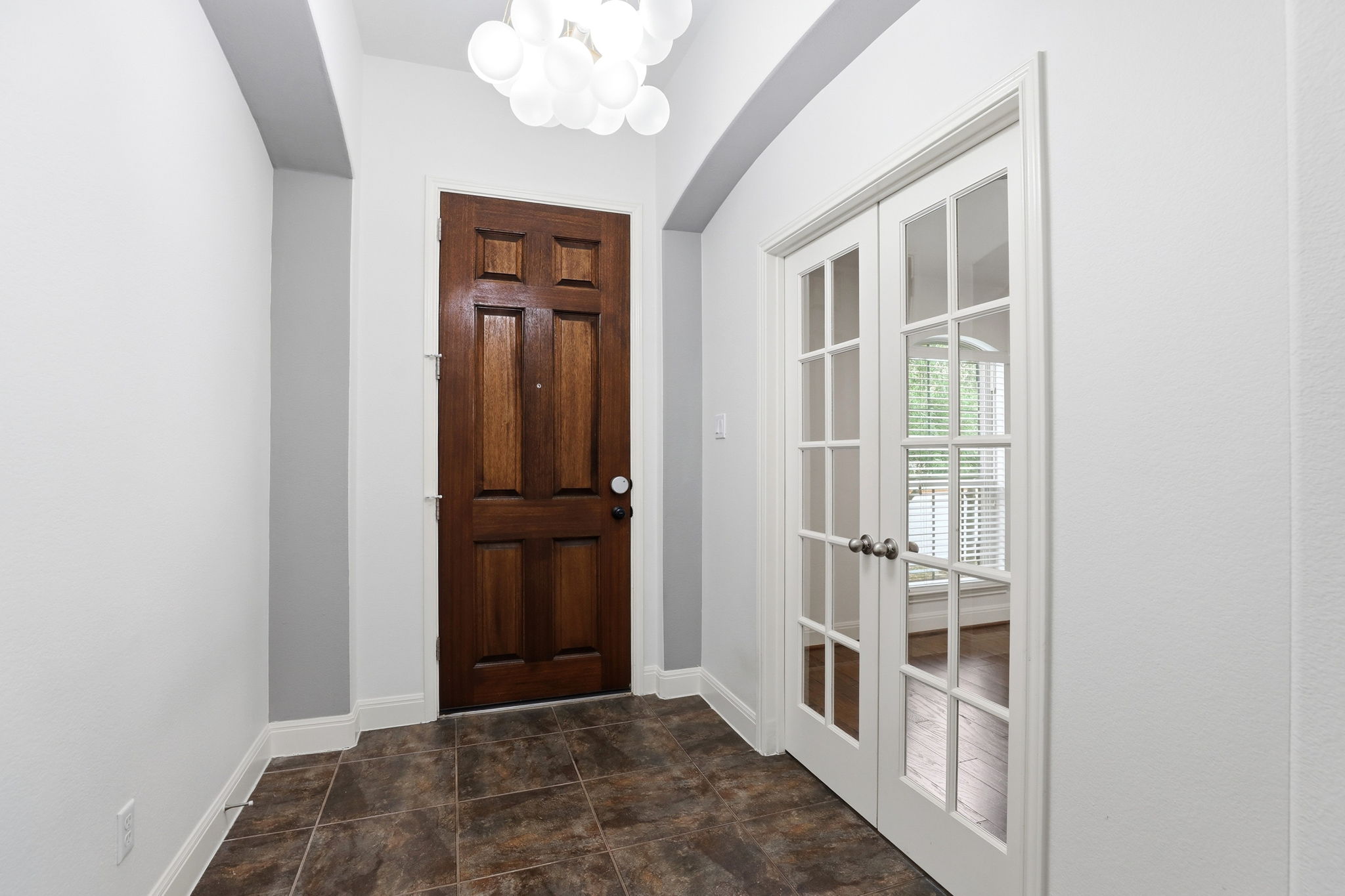 152 Stone View Trail Austin, TX 78737 - Photo 5 of 29 Entryway featuring french doors and a chandelier