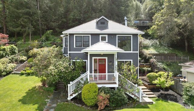 a front view of a house with a yard