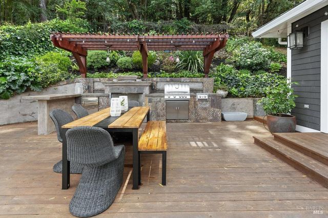 a view of an outdoor sitting area with furniture