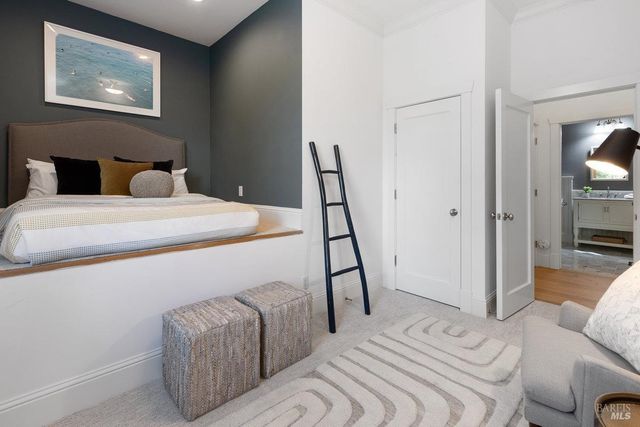 a bedroom with a bed and a couch