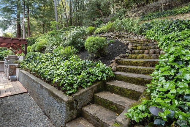 a view of a garden with outdoor seating