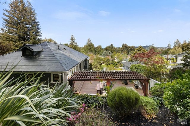 a view of a roof with sitting area