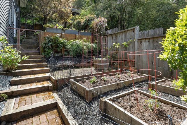 a view of a backyard with sitting area