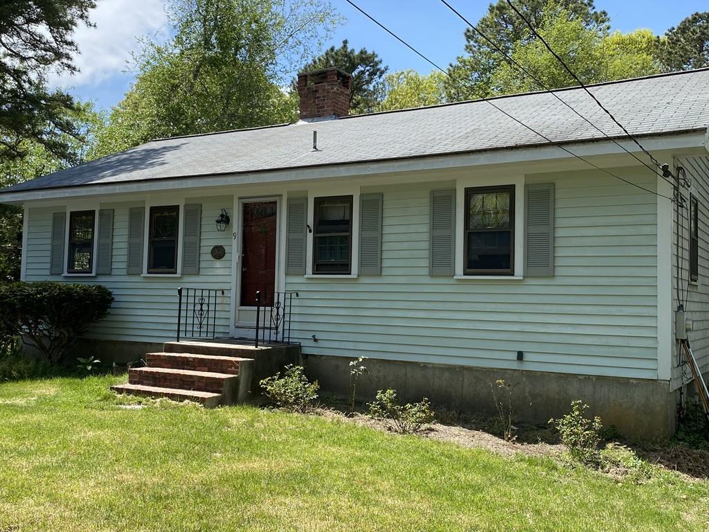 9 Uncle Percy's Road Mashpee, MA 02649 - Photo 1 of 16 a front view of a house with a yard