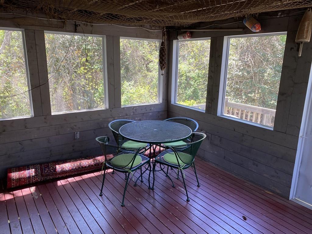 9 Uncle Percy's Road Mashpee, MA 02649 - Photo 11 of 16 a view of a dining room with furniture window and wooden floor