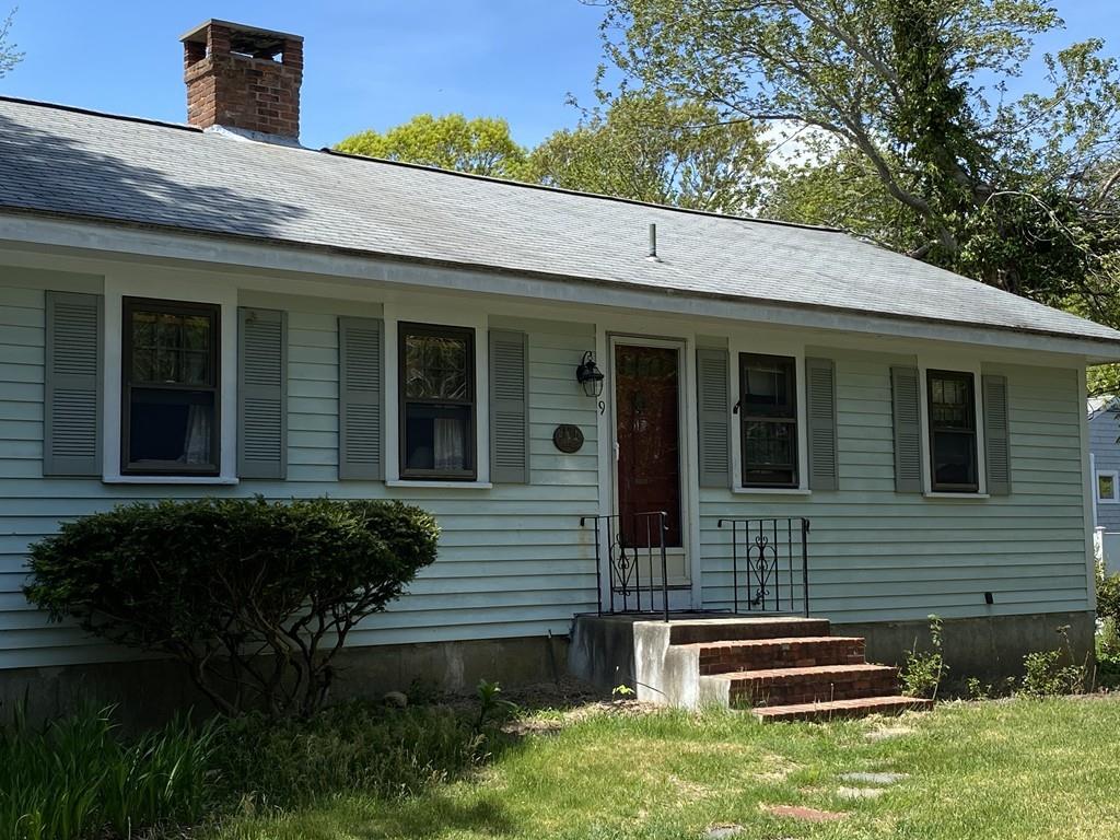 9 Uncle Percy's Road Mashpee, MA 02649 - Photo 2 of 16 a front view of a house with a yard