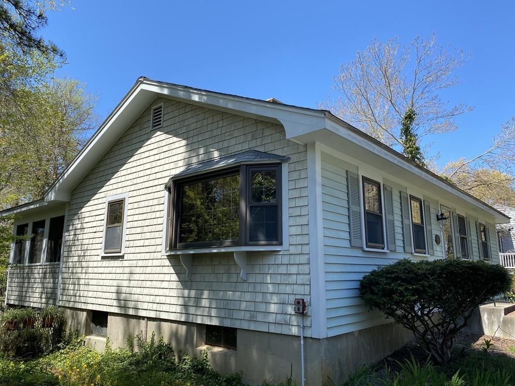 9 Uncle Percy's Road Mashpee, MA 02649 - Photo 4 of 16 a front view of a house with plants