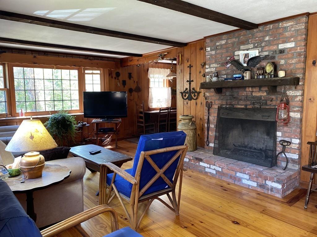 9 Uncle Percy's Road Mashpee, MA 02649 - Photo 5 of 16 a living room with furniture fireplace and flat screen tv