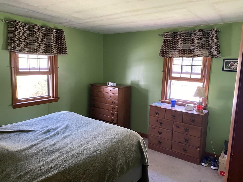 9 Uncle Percy's Road Mashpee, MA 02649 - Photo 9 of 16 a bedroom with a bed and a window