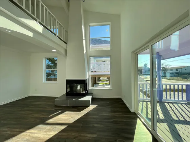 a living room with furniture fireplace and a table