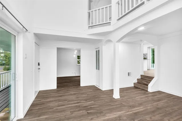 a view of entryway with wooden floor