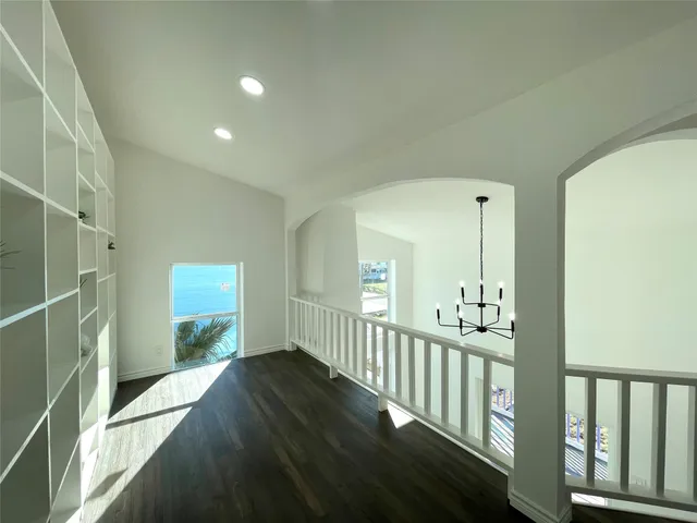 a view of a bedroom with cabinets and window