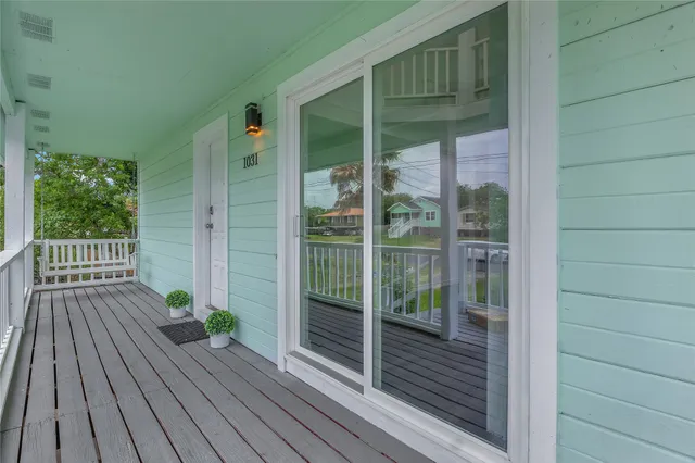 a view of balcony with wooden floor