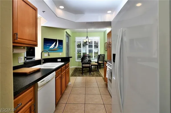 a kitchen with stainless steel appliances granite countertop a stove and a sink