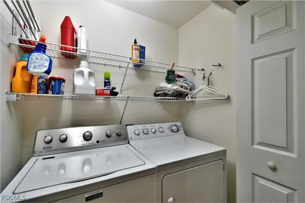 a room with lots of clutter and cabinets