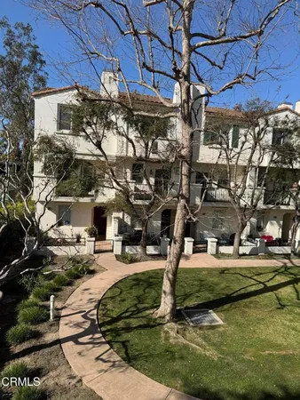 a view of a building with yard