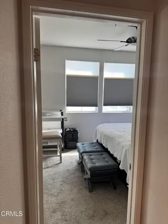 a living room with a bed and furniture